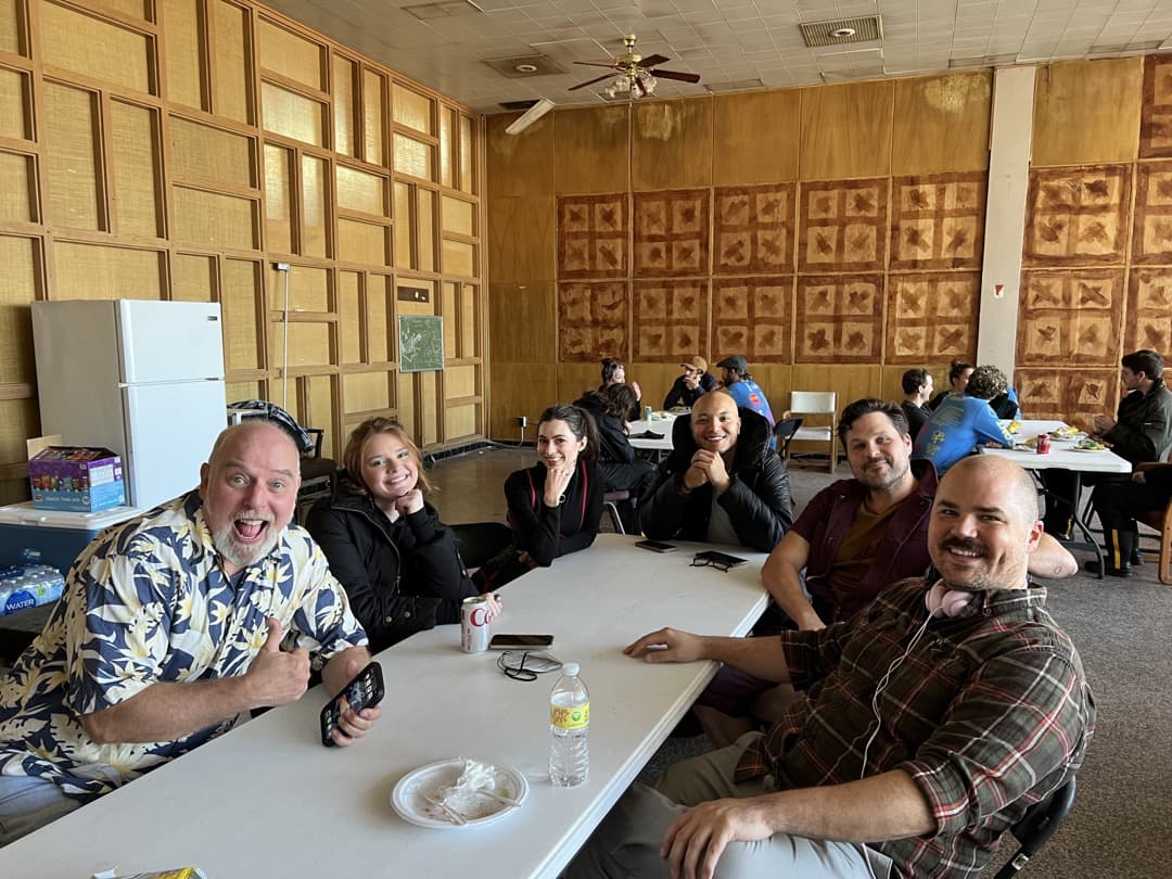 Behind the scenes photo 27 from Clone Cops production showing cast and crew at lunch